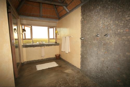 great bathroom with views on the waterhole